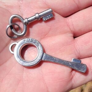 Two Vintage Fossil Key Charms